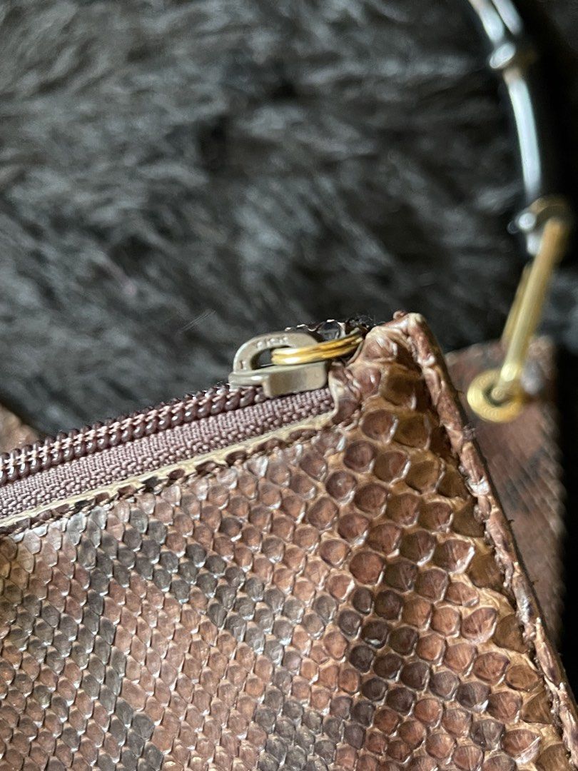 RARE Gucci Snakeskin Bamboo Shoulder bag (Category: Luxury Bags & Wallets) located in Davao. Submitted by boodle4lyf (Listing ID 1452477045, Image 2). Description: Authentic vintage GG bag. In very good condition with minimal signs of use only. Leather tag is inside the pouch. Suede interior no sticky feeling. Gold hardwares..