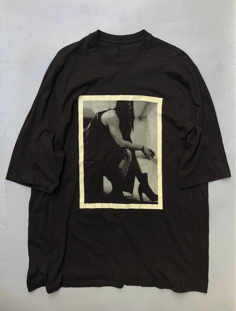 Rick Owens Graphic Print T-Shirt (Category: Luxury Apparel) located in Manila. Submitted by thriftedluxgarments (Listing ID 1452483554, Image 1). Description: - Black graphic t-shirt - Features a black and white photo print on the front - Made from 100% cotton - Tag size: XL - Perfect addition to any collection.