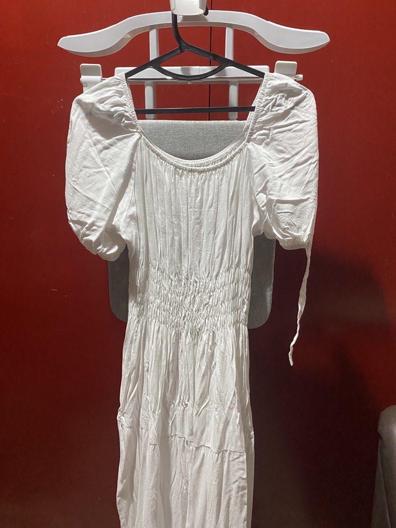 SC43 White Dress Coordinates Beach Summer (Category: Dresses) located in Bauang. Submitted by nrrandomthings (Listing ID 1452472054, Image 2). Description: - White midi dress - Square neckline with puff sleeves - Smocked bodice - Tiered skirt - Sleeve ties - Ideal for beach or summer wear - Comfortable and flowy design.