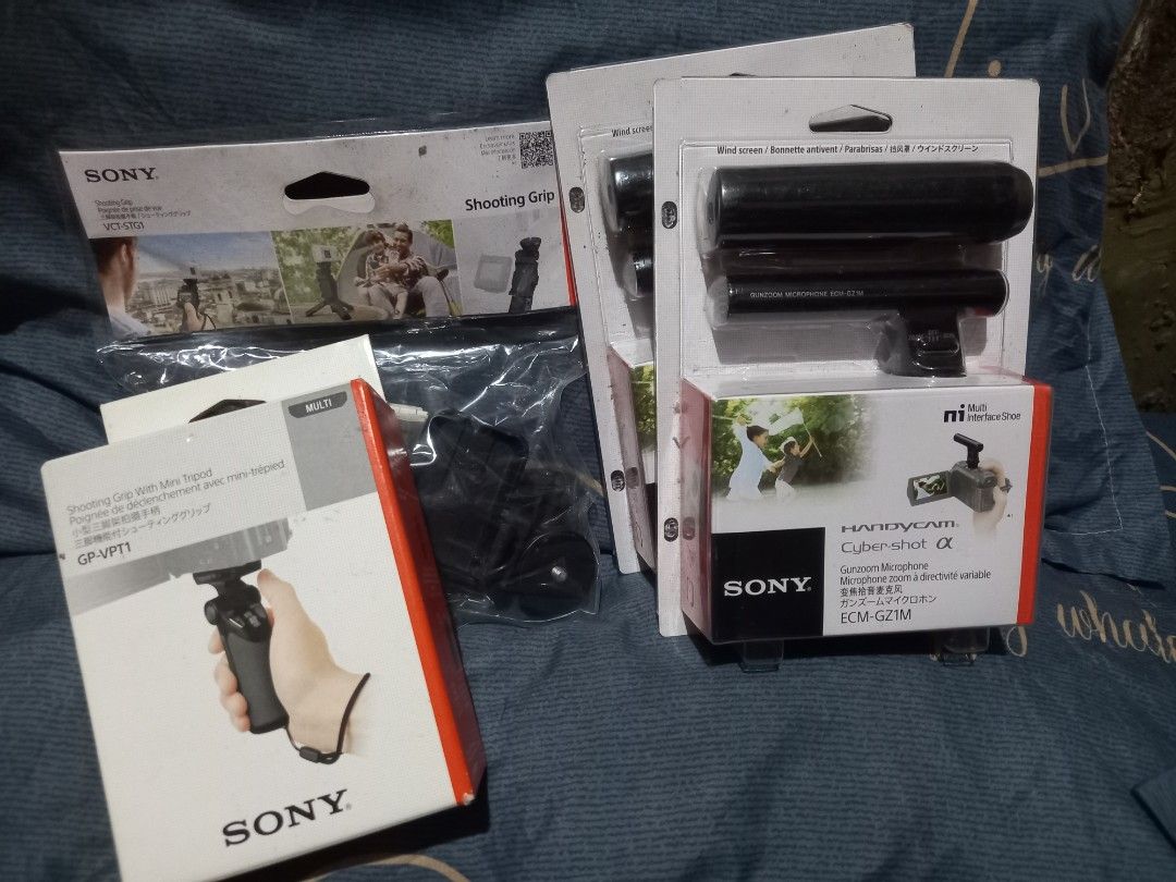 Sony Shooting Grip, Microphone, and Accessories (Category: Cameras) located in Quezon City. Submitted by weelee9280 (Listing ID 1452359592, Image 2). Description: - Sony Camera Accessory Bundle - Includes: Shooting Grip with mini tripod (GP-VPT1), Shotgun Microphone (ECM-GZ1M), and VCT-51GT Shooting Grip - All items are genuine Sony branded - Enhance your video recording capabilities - Check photos for item condition and details.