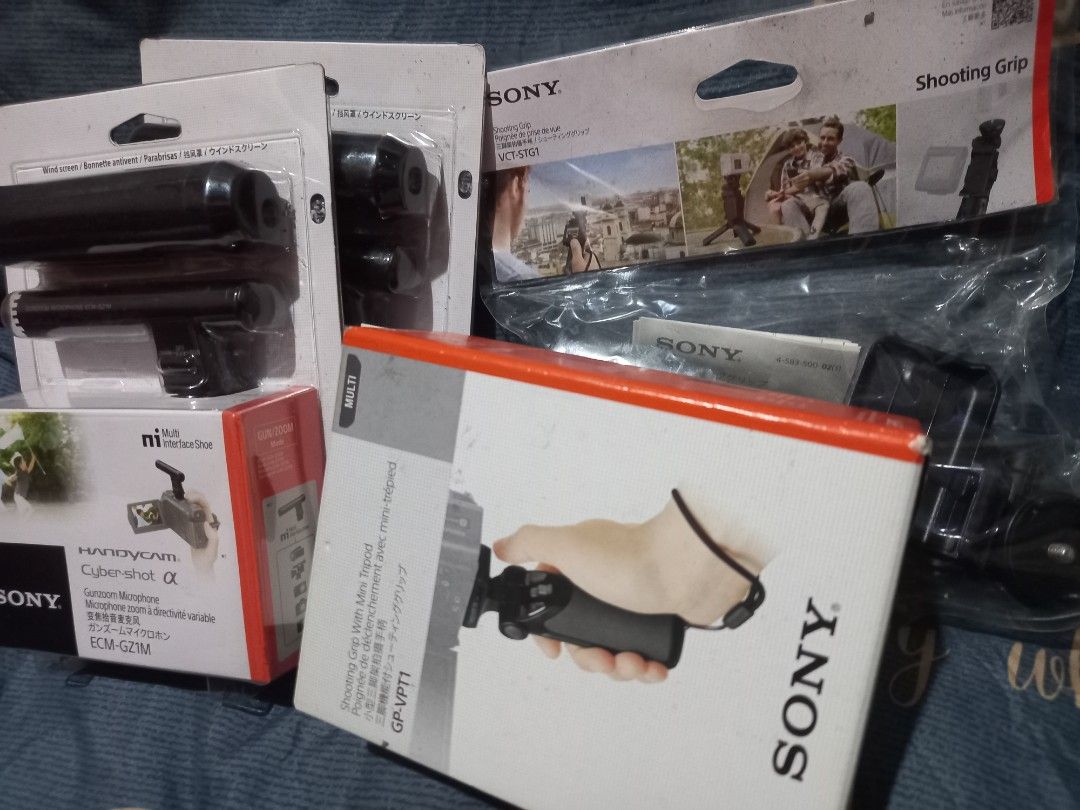 Sony Shooting Grip, Microphone, and Accessories (Category: Cameras) located in Quezon City. Submitted by weelee9280 (Listing ID 1452359592, Image 1). Description: - Sony Camera Accessory Bundle - Includes: Shooting Grip with mini tripod (GP-VPT1), Shotgun Microphone (ECM-GZ1M), and VCT-51GT Shooting Grip - All items are genuine Sony branded - Enhance your video recording capabilities - Check photos for item condition and details.