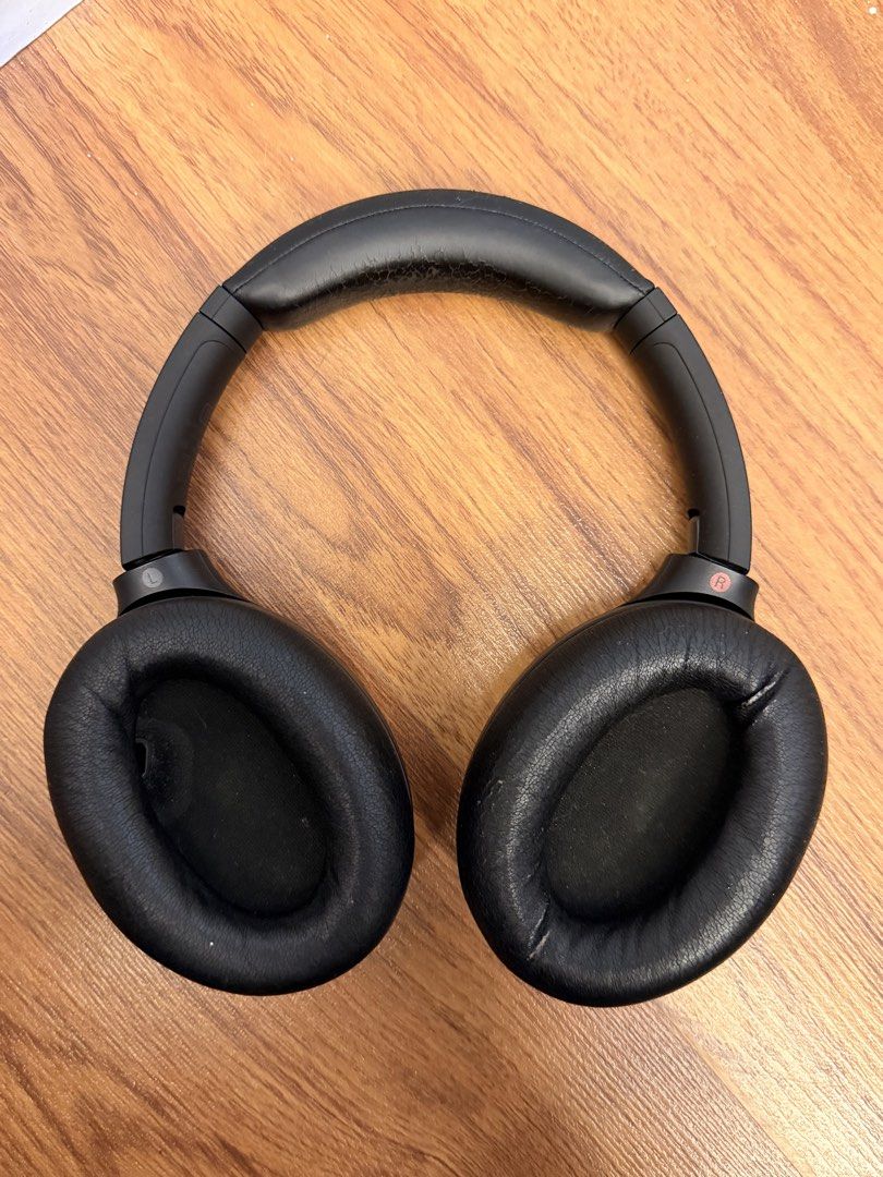 Sony WH-1000XM4 Headphones (Category: Headphones & Headsets) located in Cebu City. Submitted by ninacinimide (Listing ID 1452379329, Image 2). Description: fair condition includes a charging cable, audio cable, and a small Bluetooth adapter model number is visible on the headband negotiable! .
