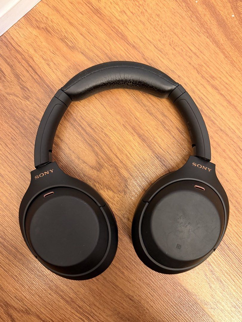 Sony WH-1000XM4 Headphones (Category: Headphones & Headsets) located in Cebu City. Submitted by ninacinimide (Listing ID 1452379329, Image 1). Description: fair condition includes a charging cable, audio cable, and a small Bluetooth adapter model number is visible on the headband negotiable! .