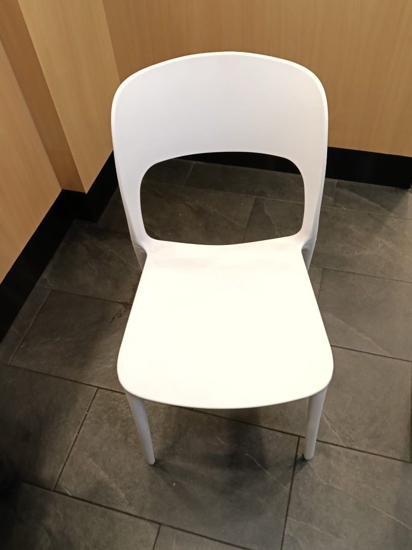 Stackable White Plastic Chairs (Category: Chairs) located in Singapore. Submitted by s.t.i (Listing ID 1452455653, Image 2). Description: - 19 Chairs Available - Easy stacking for convenient storage - Simple and modern design - Durable plastic construction - Ideal for events, cafes, or extra home seating - Black chairs available separately.