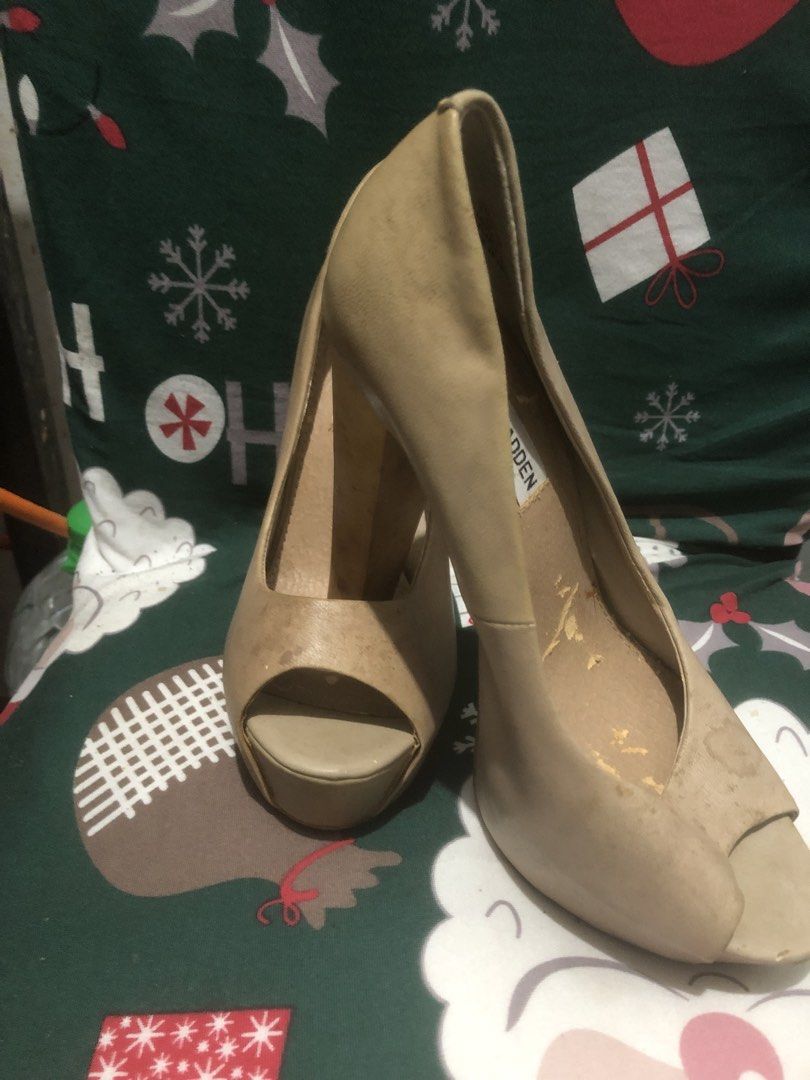 Steve Madden Peep-Toe Platform Heels (Category: Heels) located in Quezon City. Submitted by unique2shop (Listing ID 1452448816, Image 2). Description: - Brand: Steve Madden - Style: Peep-toe heels - Color: Beige/Tan - Features: Platform sole, chunky heel - Condition: Visible scuffs/marks on insoles and exterior. Soles show wear. - Notes: Still has plenty of life left for wear..
