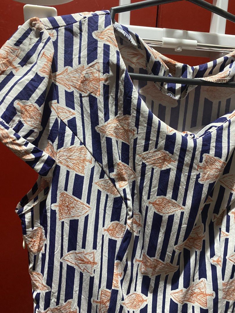 Striped Dress with Orange Leaf Pattern (Category: Dresses) located in Bauang. Submitted by nrrandomthings (Listing ID 1452471615, Image 3). Description: - Cute short-sleeved dress - Navy and white stripe pattern with orange leaf print - Pleated skirt for a nice flare - Ideal for casual outings or park days - Comfortable and easy to wear.