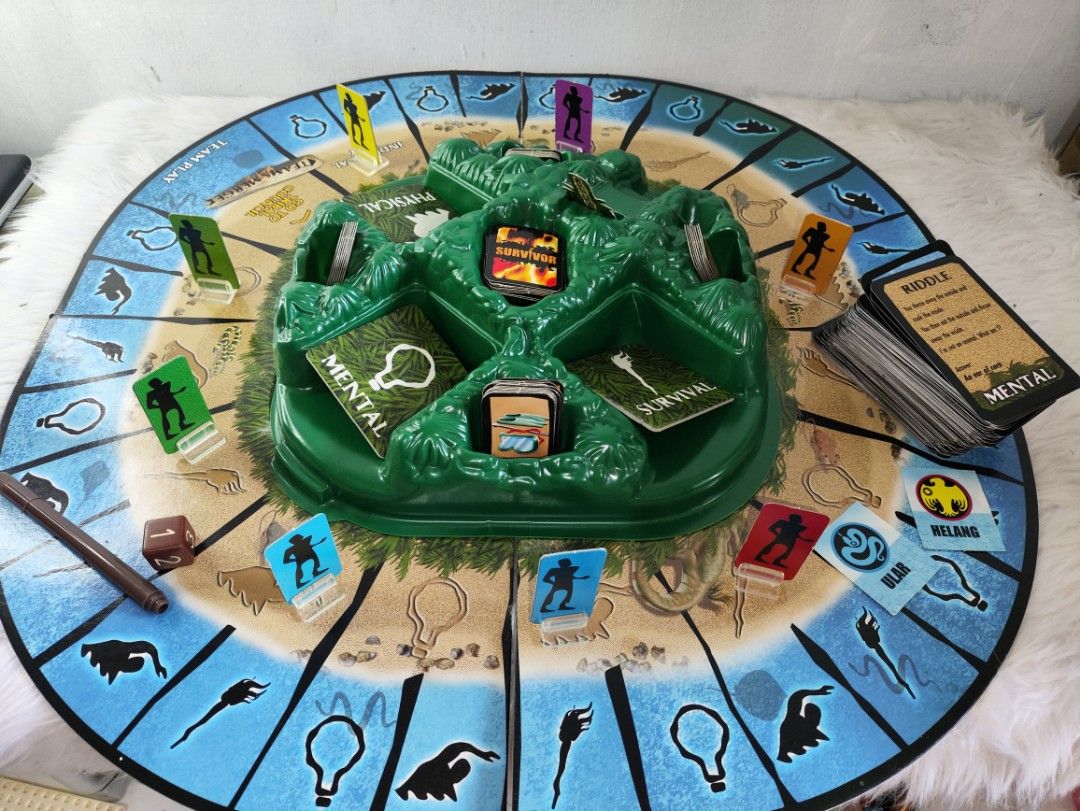 Survivor Trust No One Board Game (Category: Board Games & Puzzles) located in Cavite. Submitted by tinetaclesss (Listing ID 1452476115, Image 2). Description: - Classic Survivor board game: 'Trust No One' - Includes: game board, playing pieces, dice, and cards - Compete in mental, physical, and survival challenges - Great for game nights.