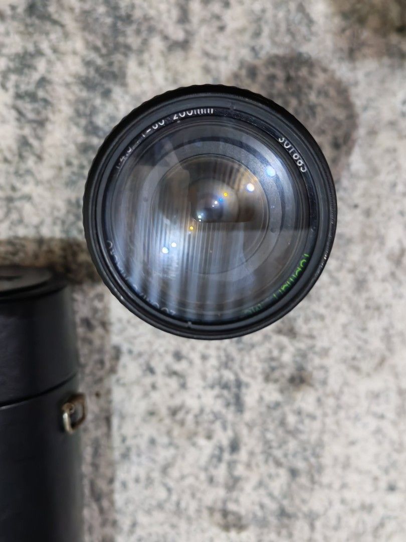 Topman Macro Zoom Lens with Case (Category: Lens & Kits) located in Binan City. Submitted by jenkinabad (Listing ID 1452343642, Image 3). Description: Vintage lens For sale Biñan laguna Lalamove Lbc Meetup up Near biñan Topman 75-200mm zoom lens - Macro function included - Made in Japan - Comes with original Topman leather case and lens cap - Smooth zoom and focus rings - Minor signs of use on exterior.