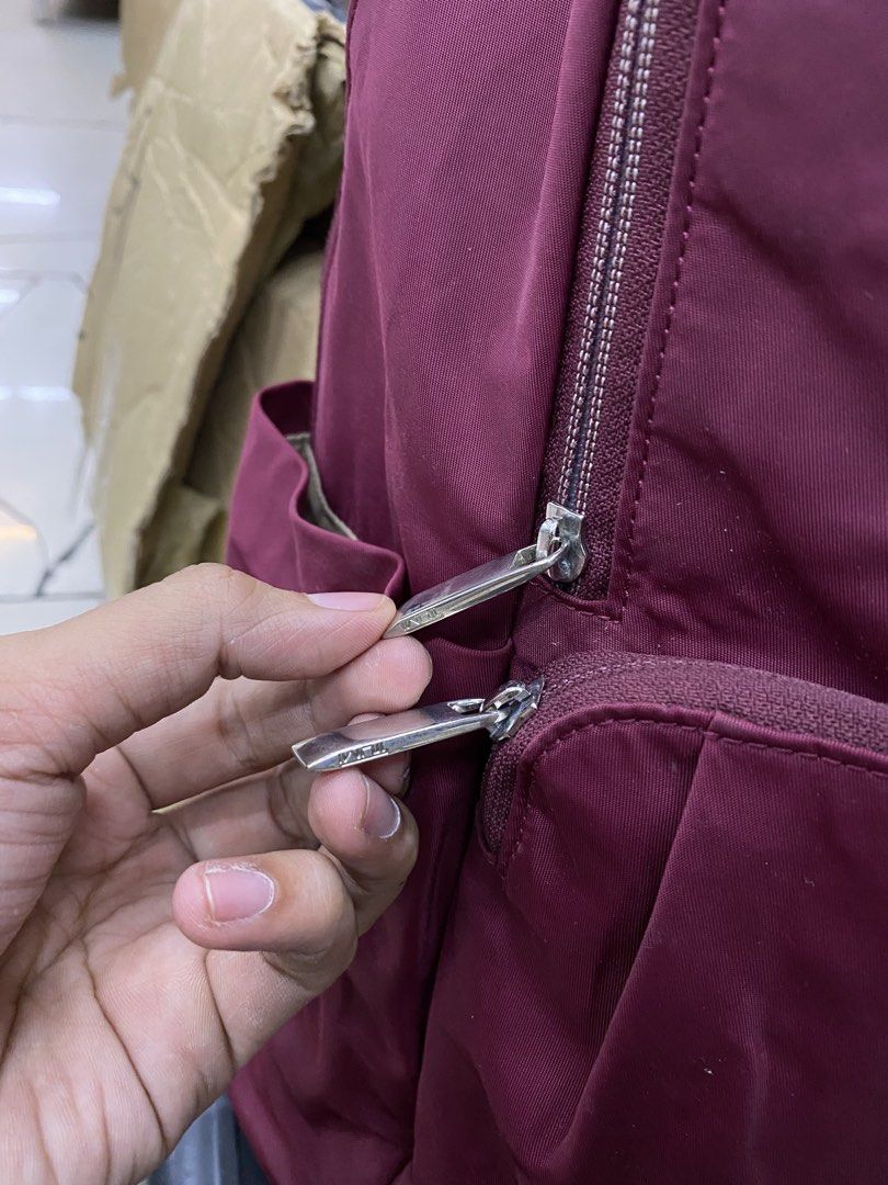 Tumi Nylon Backpack (Category: Luxury Bags & Wallets) located in Legazpi City. Submitted by folksfave (Listing ID 1452495152, Image 2). Description: Excellent condition Working zippers 9/10 color rate Clean inner Hardwares are good No holes No scratches .