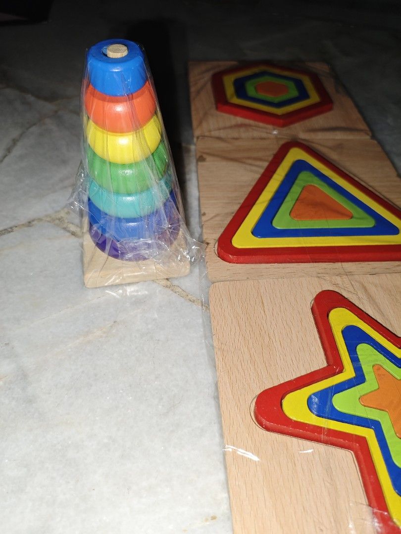 Wooden Shape Sorter & Stacking Toy Set combo 4set (Category: Toys & Games) located in Kajang. Submitted by silverfox_2f013b (Listing ID 1452357996, Image 2). Description: - Fun wooden toy set for little ones. - Includes shape sorter with hexagon, triangle, and star shapes. - Also includes a colorful stacking ring toy. - Great for developing fine motor skills and shape recognition. - Made of brightly colored wood. - Some pieces are still in origin