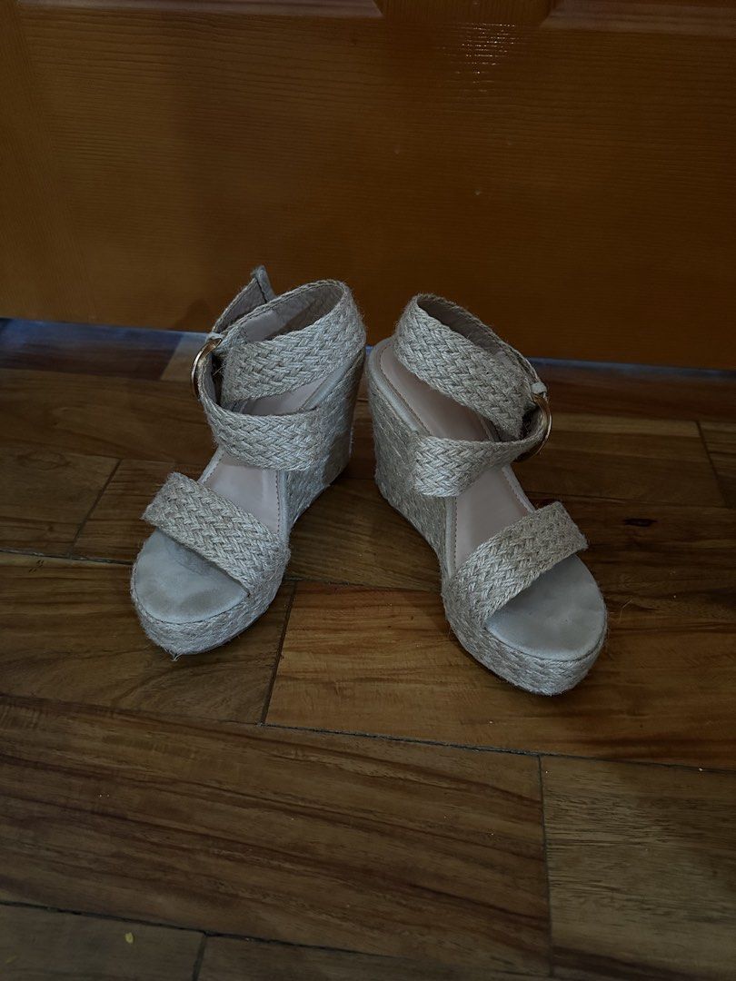Woven Espadrille Wedge Sandals with Ankle Strap (Category: Wedges) located in Quezon City. Submitted by luxenstuff (Listing ID 1452365379, Image 1). Description: - Cute espadrille wedges - Woven design - Adjustable ankle strap with buckle closure - Platform and wedge heel for added height - Natural beige/tan color - Ideal for summer outfits.