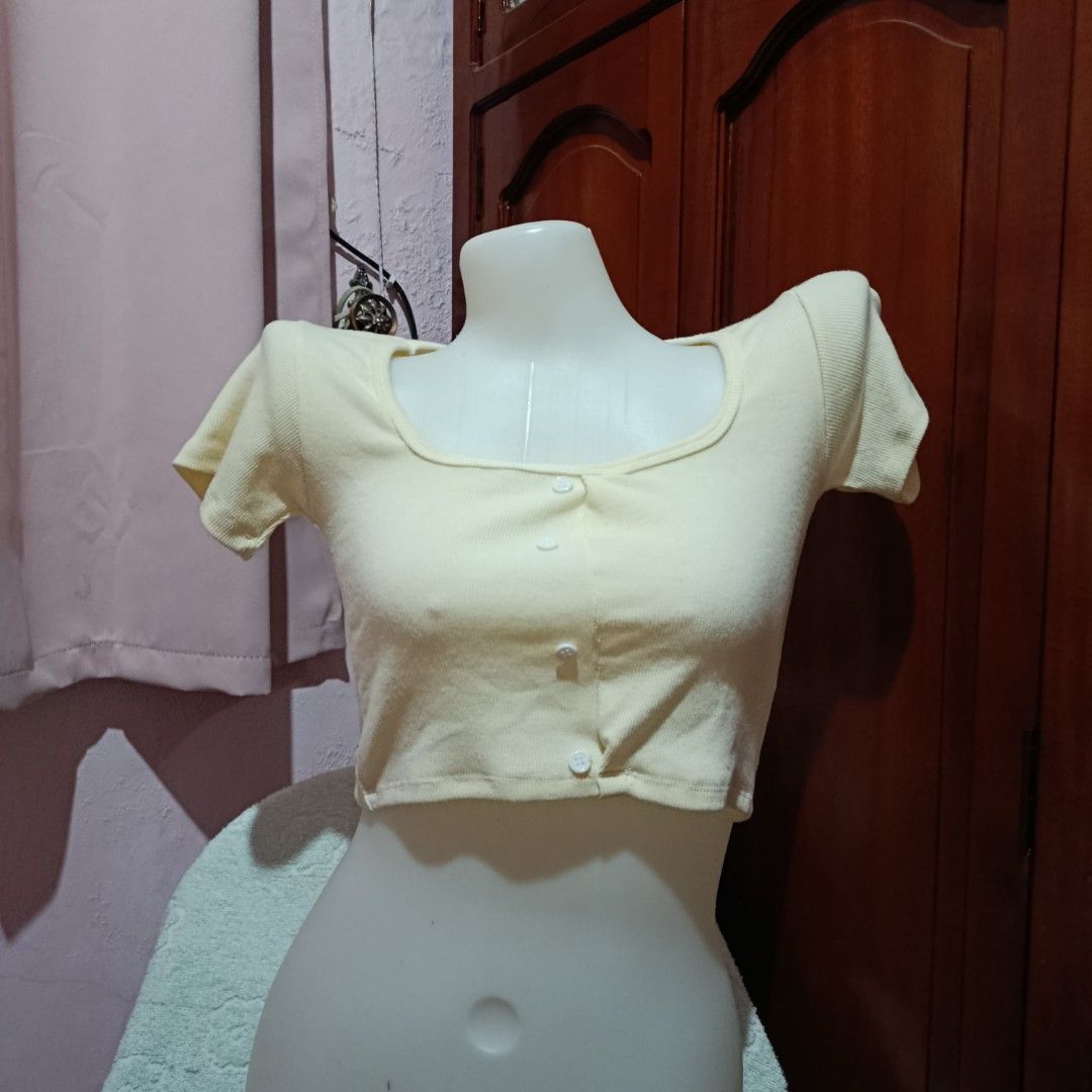 Yellow Square Neck Button Up Crop Top (Category: Blouses) located in Cabanatuan. Submitted by aicaklutter (Listing ID 1452461786, Image 1). Description: Cute yellow ribbed crop top with square neckline and button-up front. Short sleeves. Perfect for casual wear. XS-S Loc: Cabanatuan, Nueva Ecija Courier: JnT.