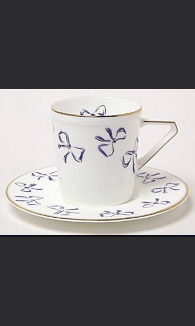 YSL Cup and Saucer (Category: Coffee & Tea Tableware) located in Imus. Submitted by luxefad (Listing ID 1452399700, Image 1). Description: - Adorable cup and saucer set - Classic white ceramic - Charming blue bow pattern - Elegant gold trim detailing - Perfect for enjoying coffee or tea - Makes a wonderful gift - A lovely addition to any collection 5 sets available .