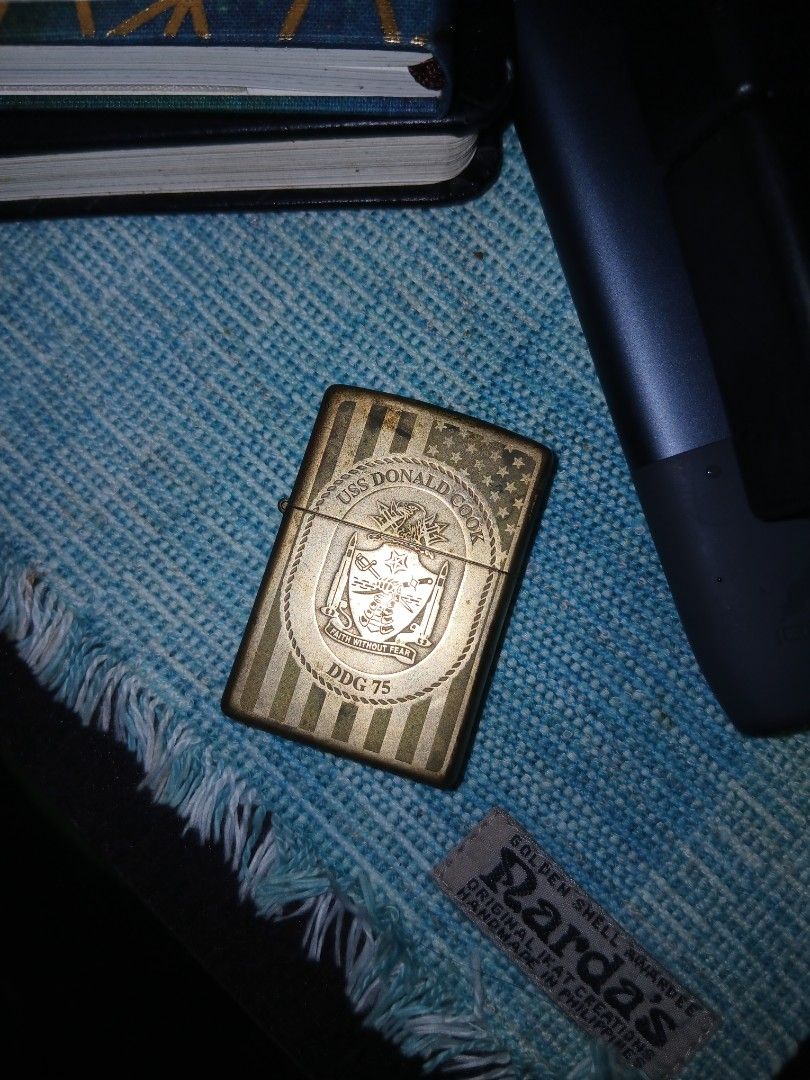 Zippo Lighter USS Donald Cook DDG 75 (Category: Vintage Collectibles) located in Manila. Submitted by cosmicturtle.d1b615 (Listing ID 1452445252, Image 1). Description: - Vintage Zippo lighter - Engraved with USS Donald Cook DDG 75 - Classic striped body design - Ideal collectible for naval enthusiasts - Functional, requires fluid.