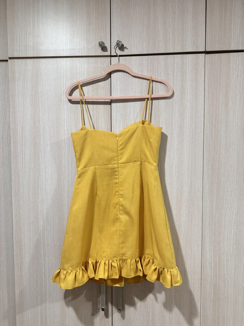 ZOO Yellow Ruffle Hem Mini Dress (Category: Dresses) located in Quezon City. Submitted by _hellosunshine (Listing ID 1452407583, Image 3). Description: Brighten up your wardrobe with this gorgeous ZOO sunshine yellow mini dress! 💛 💰 Current retail price: ₱2,690 🏷️ Selling for: ₱2,200 (slightly negotiable) This flattering dress features a structured bustier-style bodice, delicate spaghetti straps, and a playful ruffle hem that makes it perfect 