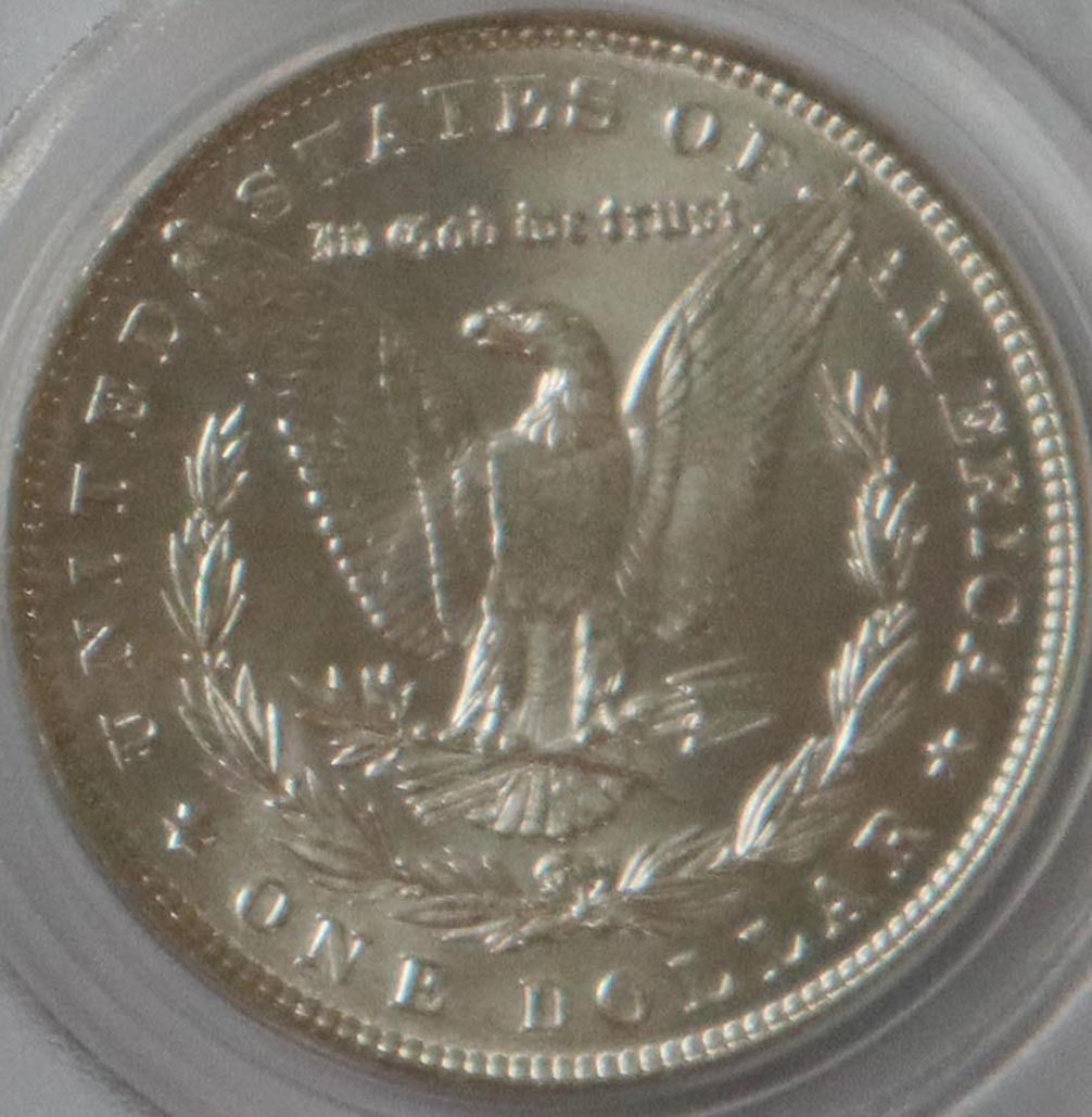 1886 Morgan Silver Dollar MS63 PCGS Graded Coin B (Category: Currency) located in Caloocan City. Submitted by oldbestseller72 (Listing ID 1452529153, Image 3). Description: - 1886 Morgan Silver Dollar - Graded MS63 by PCGS - Features a unique mint mark - Excellent addition for coin collectors - Old PCGS Holder - Serial Number: 7166.63/1497843.