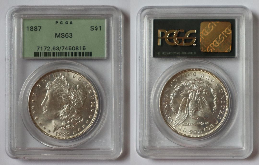 1887 Morgan Silver Dollar MS63 PCGS Graded Coin (Category: Currency) located in Caloocan City. Submitted by oldbestseller72 (Listing ID 1452530009, Image 1). Description: - 1887 Morgan Silver Dollar - Graded MS63 by PCGS - Features a unique mint mark - Excellent addition for coin collectors - Old PCGS Holder - Serial Number: 7172.63/7450815.