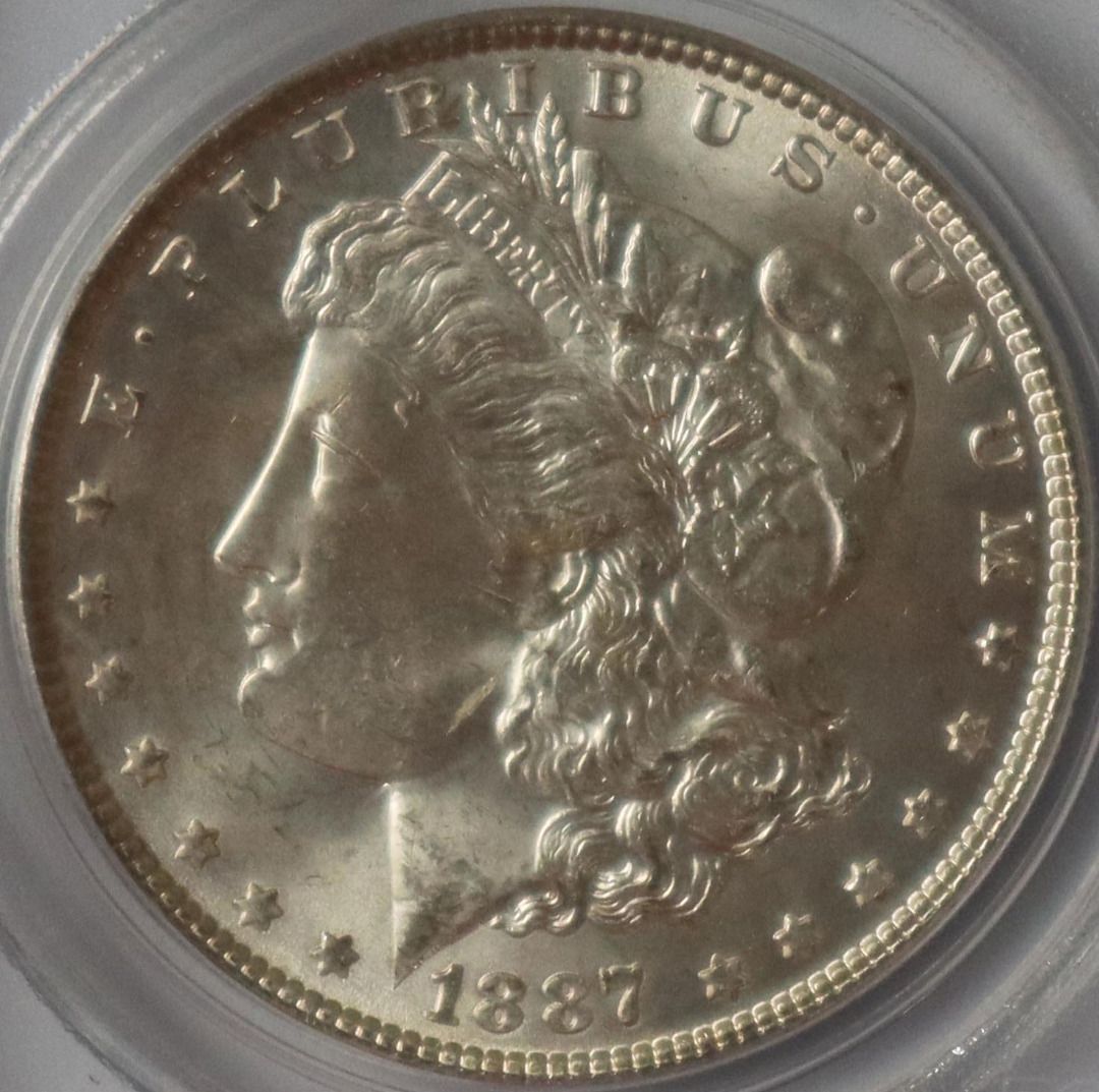 1887 Morgan Silver Dollar MS63 PCGS Graded Coin (Category: Currency) located in Caloocan City. Submitted by oldbestseller72 (Listing ID 1452530009, Image 2). Description: - 1887 Morgan Silver Dollar - Graded MS63 by PCGS - Features a unique mint mark - Excellent addition for coin collectors - Old PCGS Holder - Serial Number: 7172.63/7450815.