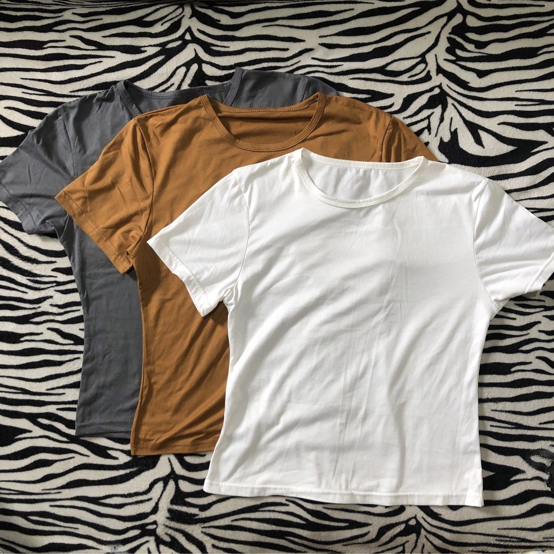 3 Basic Tops (Category: Shirts) located in Muntinlupa City. Submitted by ksclocollection (Listing ID 1452573373, Image 1). Description: 3 pcs basic tops (never been used, almost new) fit to med to large girlies color: White, Mustard, Gray All for 150.