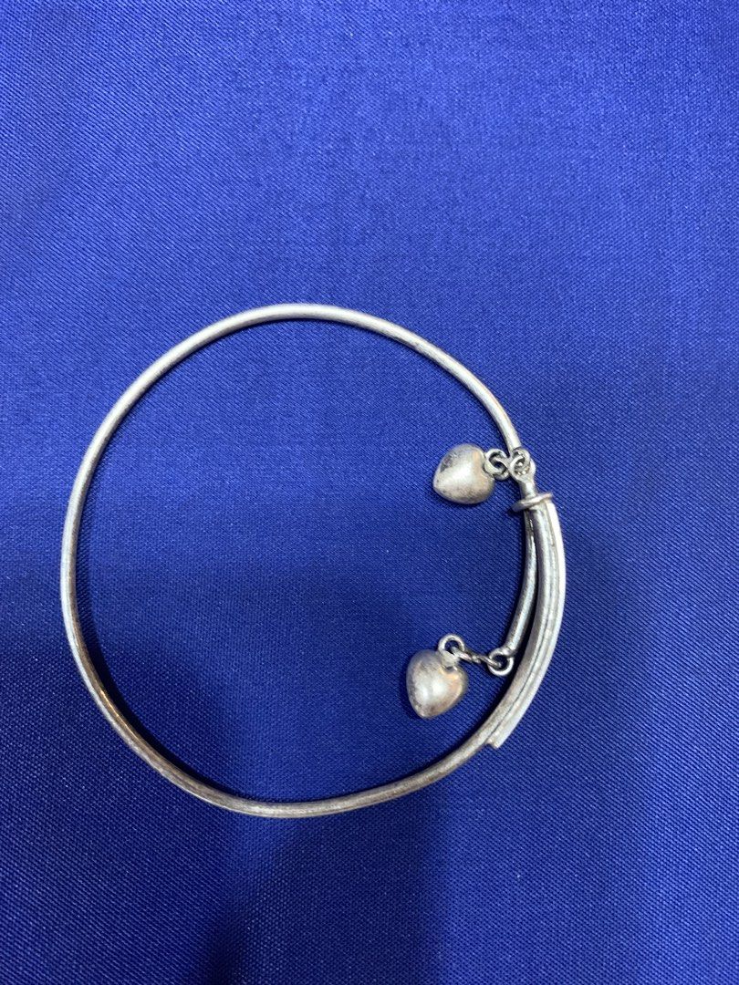 925 sterling silver bracelet (Category: Bracelets) located in Davao. Submitted by mj_2021 (Listing ID 1452562721, Image 1). Description: Take All for only ₱1,900 1. Adjustable Bracelet with dangling (two hearts) size: medium to large condition: deformed (common issue ng mga adjustable rings and bracelet) 2. Premium Italy silver with minimal flaws (hindi halata pagsuot na) size: 7.5 inches unique design (unisex) 3.8 grams Take All ₱1,900 markings 