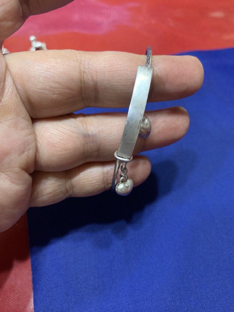 925 sterling silver bracelet (Category: Bracelets) located in Davao. Submitted by mj_2021 (Listing ID 1452562721, Image 2). Description: Take All for only ₱1,900 1. Adjustable Bracelet with dangling (two hearts) size: medium to large condition: deformed (common issue ng mga adjustable rings and bracelet) 2. Premium Italy silver with minimal flaws (hindi halata pagsuot na) size: 7.5 inches unique design (unisex) 3.8 grams Take All ₱1,900 markings 