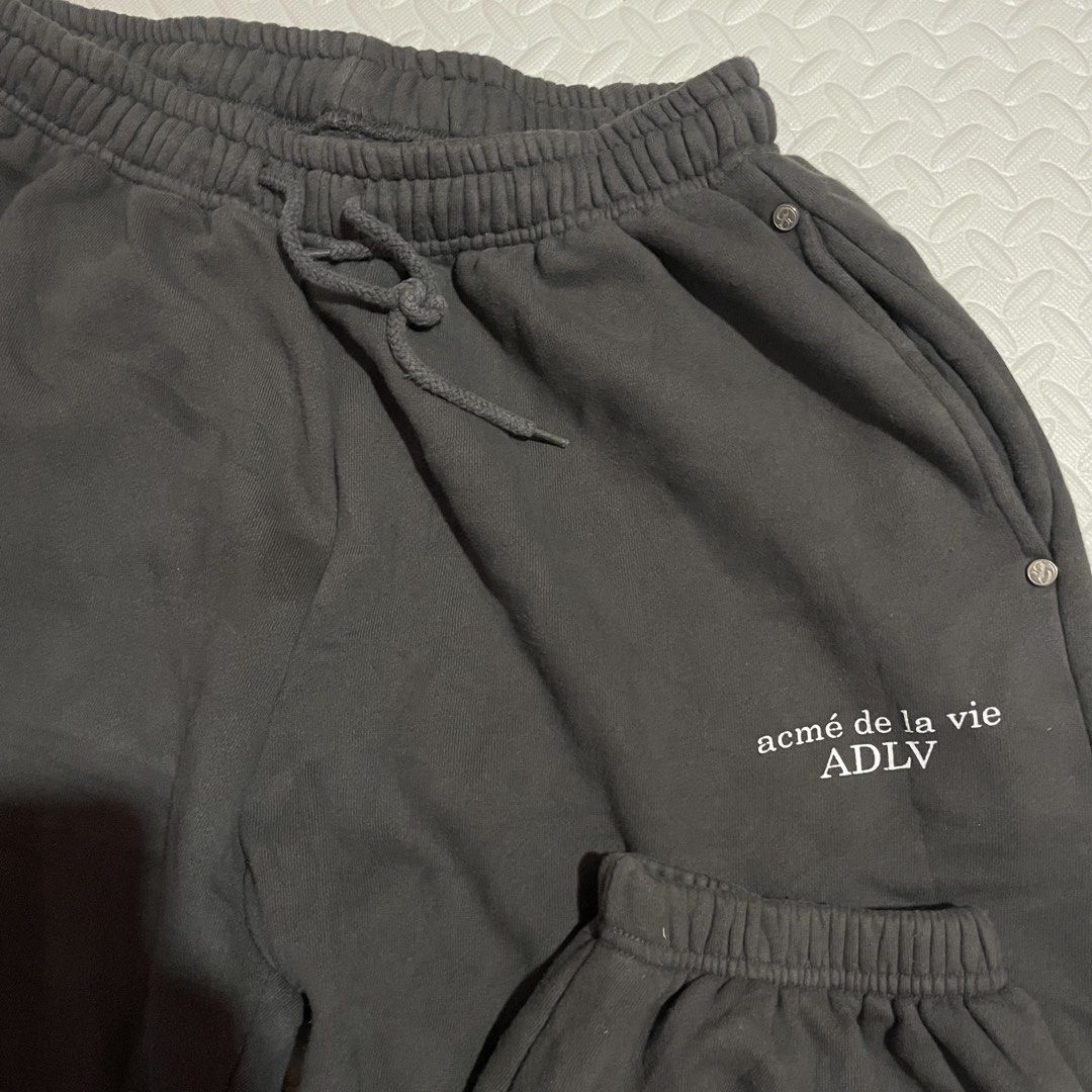 Acme de la Vie ADLV Grey Sweatpants (Category: Joggers) located in Zamboanga. Submitted by selvege (Listing ID 1452616971, Image 3). Description: - Grey sweatpants from Acme de la Vie (ADLV) - Elastic waistband with drawstring for adjustable fit - Cuffed ankles for a snug feel - ADLV logo printed on the left leg - Two convenient side pockets - Small ADLV logo tag on the back pocket - Comfortable and stylish design.