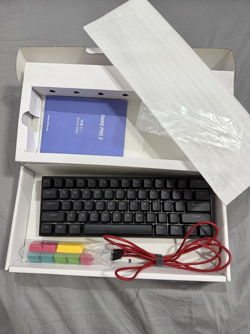 Anne Pro 2 Mechanical Keyboard (Category: Computer Keyboard) located in Quezon City. Submitted by hagendaaazs (Listing ID 1452654456, Image 1). Description: - Anne Pro 2 Mechanical Keyboard - Compact 60% Layout - Includes Original Box, Manual, and Extra Keycaps - Red USB-C Cable - Ideal for Gaming and Typing - Ready for a New Home RFS: dismantled and sold PC setup.
