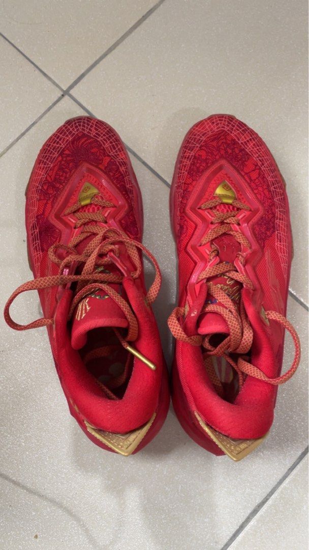 ANTA KAI 2 (Category: Sneakers) located in Manila. Submitted by sellwithbelly (Listing ID 1452552864, Image 2). Description: - Red basketball shoes with striking gold accents. - Features a unique, eye-catching pattern on the upper. - Comes with matching red laces. - Perfect for hitting the court or for stylish casual wear. - Reason for selling: No longer needed. - Please check the photos for a closer look at the condition..