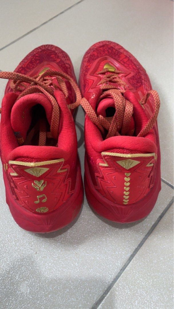 ANTA KAI 2 (Category: Sneakers) located in Manila. Submitted by sellwithbelly (Listing ID 1452552864, Image 3). Description: - Red basketball shoes with striking gold accents. - Features a unique, eye-catching pattern on the upper. - Comes with matching red laces. - Perfect for hitting the court or for stylish casual wear. - Reason for selling: No longer needed. - Please check the photos for a closer look at the condition..