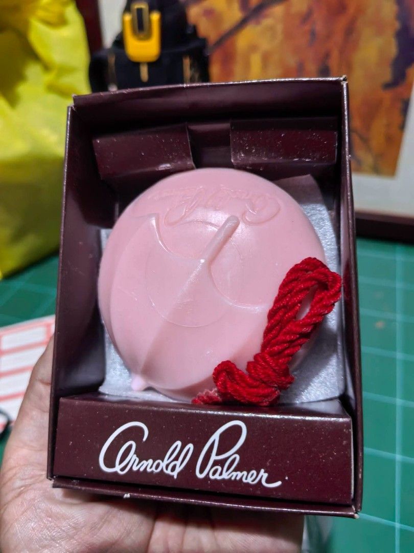 Aromatic Bath Soap - Arnold Palmer (Category: Bath) located in Cebu City. Submitted by dudes_villanueva (Listing ID 1452661242, Image 3). Description: Aromatic Bath Soap - Arnold Palmer 📌 Branded round bath soap, from Japan. 📌 The pink soap features the signature Arnold Palmer umbrella motif molded into the surface. 📌 It includes a red rope attachment for hanging, making it suitable for functional display 📌 The soap comes in a branded gift bo