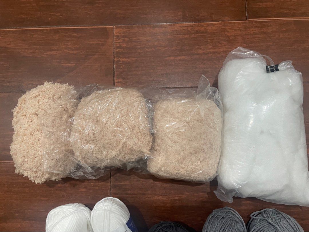 Assorted Yarn Balls and Stuffing for Crafts (Category: Craft Supplies & Tools) located in Pasig City. Submitted by trish_p (Listing ID 1452662753, Image 3). Description: - Bundle includes milk cotton yarn: white, charcoal, gray, brown, light pink, coral - Also includes three bags of beige fleece yarn and one bag of white stuffing/filler. - Ideal for knitting, crocheting, and making plush toys. - RFS: declutterring crochet/amigurumi materials Cora