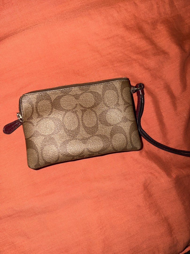 Authentic Preloved Coach Corner Zip Wristlet Leather Maroon (Category: Luxury Bags & Wallets) located in Quezon City. Submitted by closetbymira_ (Listing ID 1452657044, Image 3). Description: Authentic Have scratches and peeling leather Visible signs of usage.