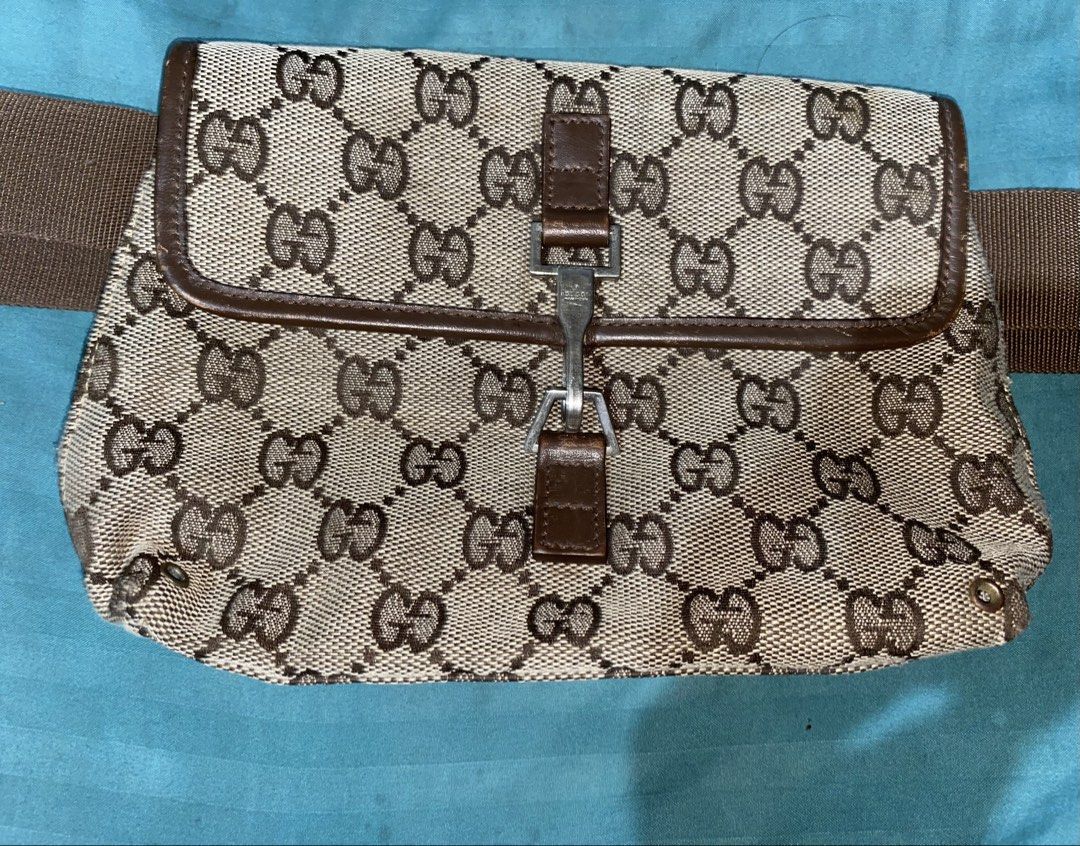 Authentic Vintage Gucci Monogram Canvas Waist Bag (Category: Luxury Bags & Wallets) located in Manila. Submitted by ria_smnth (Listing ID 1452521043, Image 1). Description: - Authentic Gucci GG monogram canvas waist bag - Brown leather trim and strap - Silver buckle closure - Perfect for keeping essentials accessible.