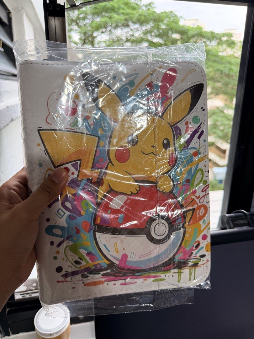 Binders (Category: Trading Cards Accessories) located in Singapore. Submitted by rerlon (Listing ID 1452606164, Image 5). Description: Pokemon Theme Binders Multiple Binders Available Design 1 - Picture 1&2 Design 2 - Picture 3&4 Design 3 - Picture 5&6 All binders are top loadable, 4 grids, side inserts, 20 pages, 200 card slots in total! Great for collectors.