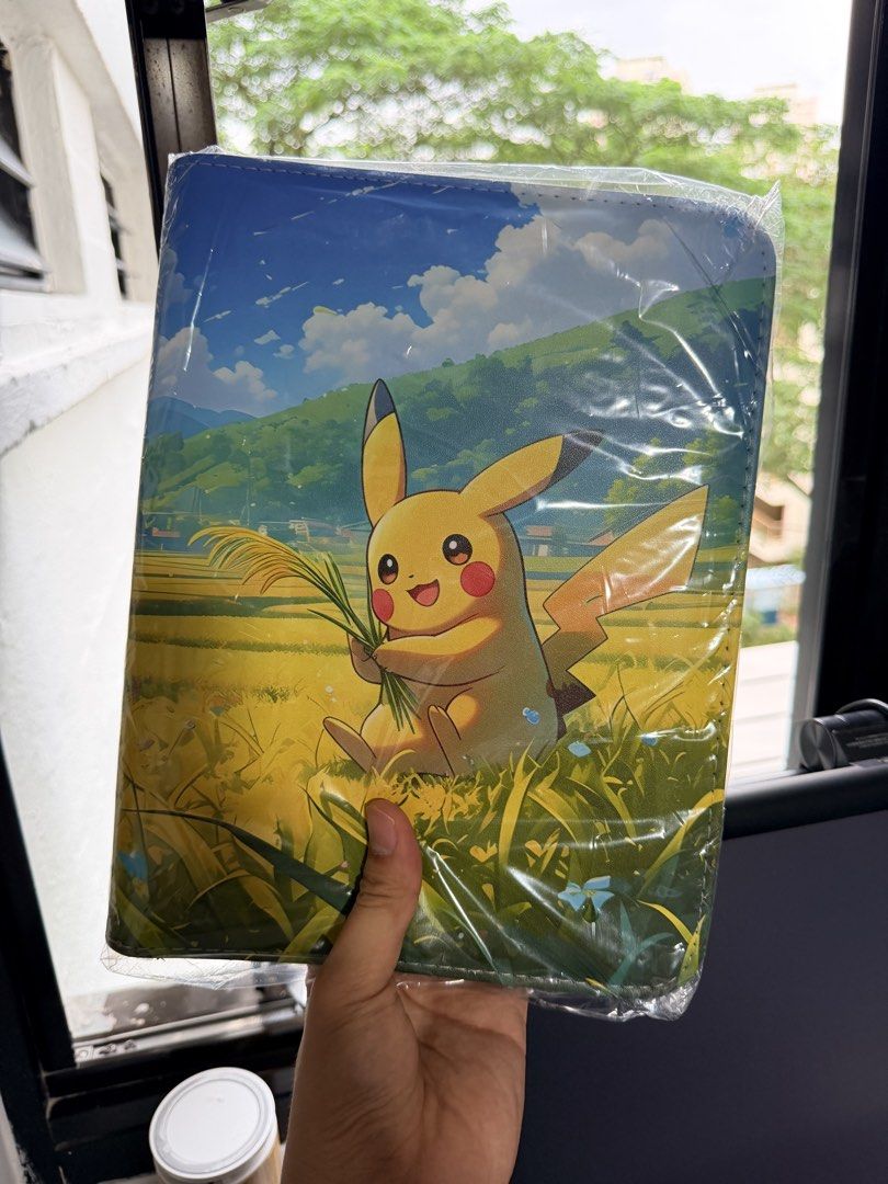 Binders (Category: Trading Cards Accessories) located in Singapore. Submitted by rerlon (Listing ID 1452606164, Image 3). Description: Pokemon Theme Binders Multiple Binders Available Design 1 - Picture 1&2 Design 2 - Picture 3&4 Design 3 - Picture 5&6 All binders are top loadable, 4 grids, side inserts, 20 pages, 200 card slots in total! Great for collectors.