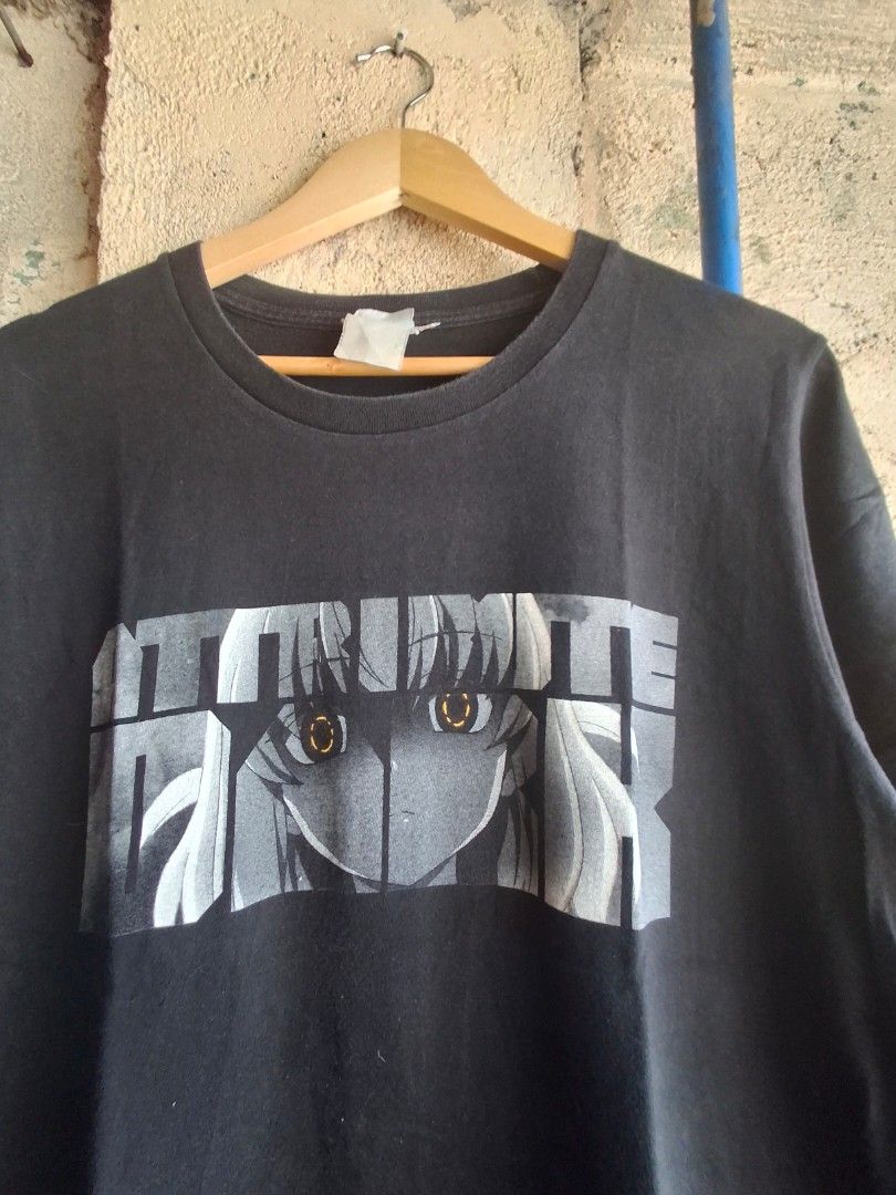 Black Anime Graphic T-Shirt (Category: Activewear) located in Quezon City. Submitted by Thriftallthetime (Listing ID 1452583628, Image 2). Description: - Black t-shirt with unique anime graphics. - Front design: Close-up anime eyes with text. - Back design: Chibi anime character with text. - Ideal for anime fans and collectors. - Made from comfortable, breathable fabric..