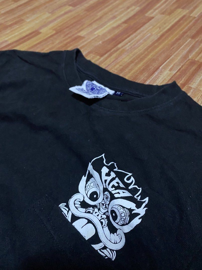 Black T-shirt with Graphic Print (Category: Tshirts & Polo Shirts ) located in Manila. Submitted by drip-from-thrift (Listing ID 1452510394, Image 2). Description: - Black t-shirt - Features a cool graphic print on the front pocket and back - Made with good quality material - Ideal for casual everyday wear.