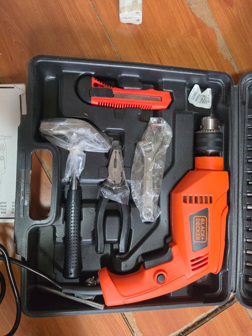 Black+Decker Hammer Drill Set with Accessories (Category: Construction Tools & Equipment) located in Santa Rosa. Submitted by november.days (Listing ID 1452544626, Image 2). Description: - Black+Decker Hammer Drill Set - Perfect for home DIY projects - Includes: Hammer drill, various drill bits, screwdriver bits, screws, wall plugs, utility knife, pliers, hammer - Comes with a durable carrying case for easy storage and transport - Power cord incl