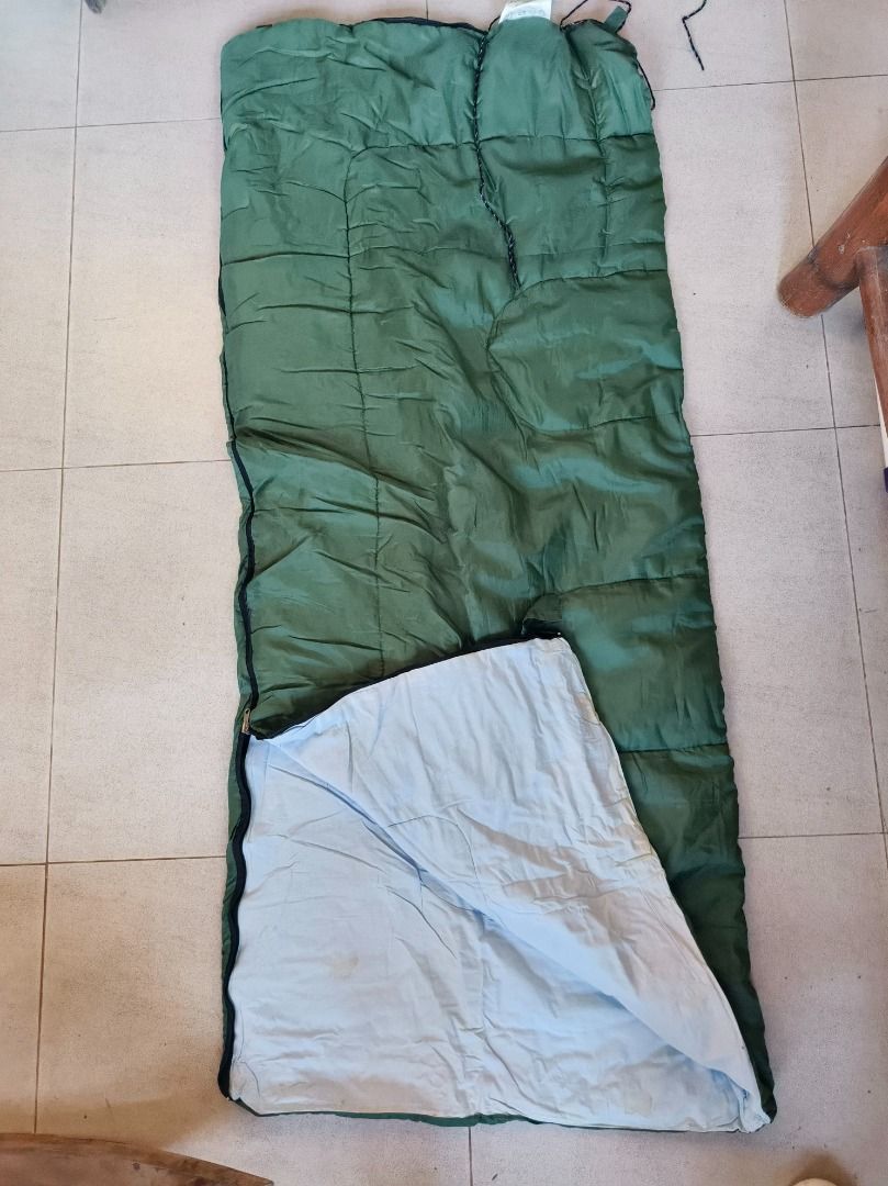 2pcs Blue Plaid Lined Sleeping Bag (Category: Hiking & Camping) located in San Leonardo. Submitted by burgossanleonardo.12345 (Listing ID 1452593456, Image 2). Description: - 2pcs take all - Unfolded sleeping bag - Blue outer shell with plaid lining - Separate blue padded section with snaps - Drawstrings at the top for closure - Ideal for camping and outdoor use - Ready for your next adventure!.