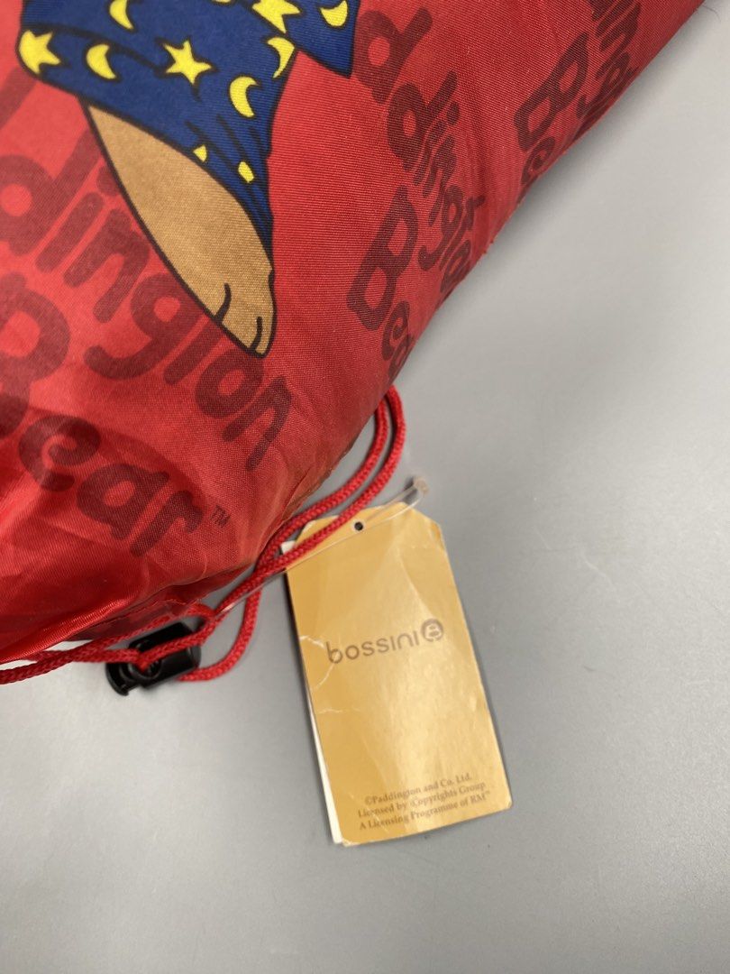 Bossini Paddington Bear Sleeping Bag (Category: Bedding & Towels) located in Baguio. Submitted by treshijos88888-72820 (Listing ID 1452624967, Image 3). Description: - Adorable Paddington Bear sleeping bag by Bossini. - Features Paddington in pajamas on a vibrant red background. - Cozy blue interior with a fun pattern. - Ideal for children's sleepovers or outdoor adventures. - Comes with a convenient drawstring storage bag..