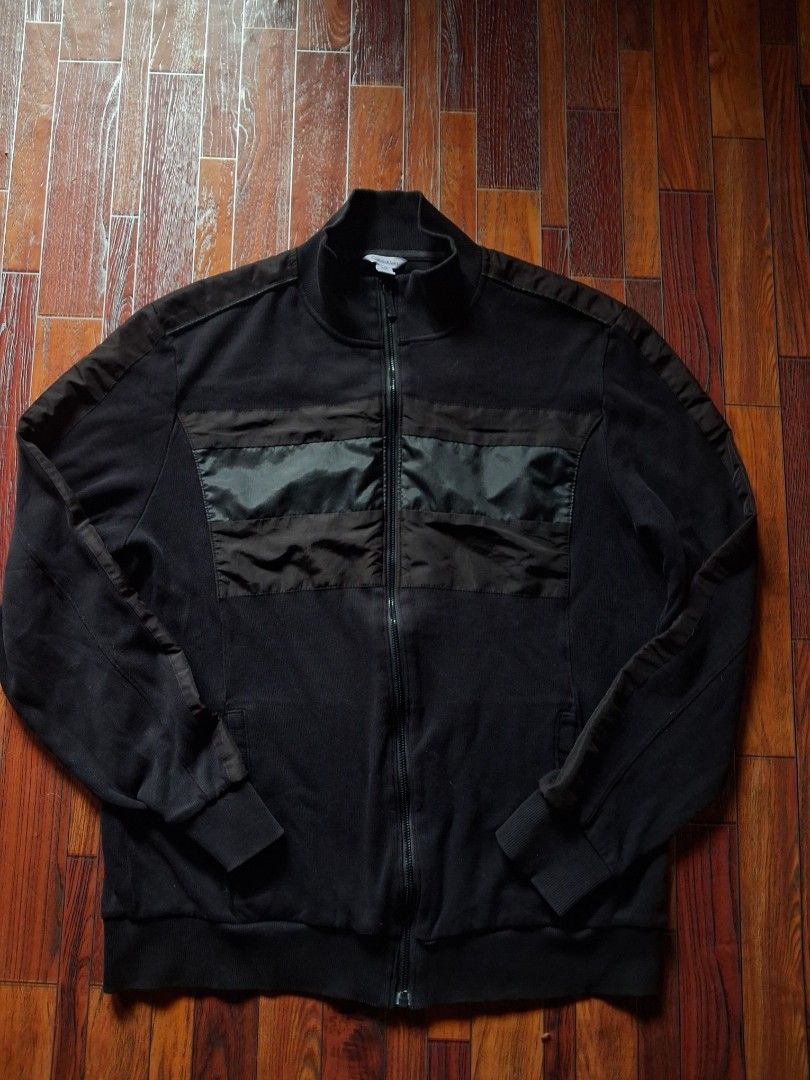 Calvin Klein Black Zip-Up Jacket L/G (Category: Coats, Jackets and Outerwear) located in Cavite. Submitted by eks1999 (Listing ID 1452543890, Image 1). Description: - Black Calvin Klein Jacket - Size: L/G - Material: 100% Cotton - Features: Full zip closure, ribbed cuffs and hem, contrasting fabric panels on chest - Style: Casual wear.