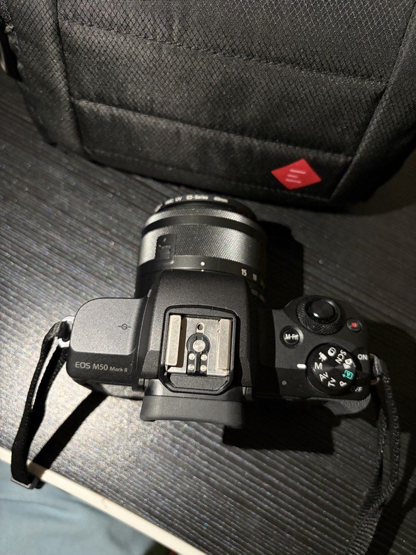 Canon EOS M50 Mark II Mirrorless Camera (Category: Cameras) located in Quezon City. Submitted by pingg26 (Listing ID 1452634496, Image 3). Description: - Canon EOS M50 mark II mirrorless camera - kit lens 15-45mm - 2 batteries - charger and cord - bag - neck strap - 32 gb sandisk ultra SD card - SD card reader - screen protector - box and manuals *see photos for camera conditions *good as new, barely use.