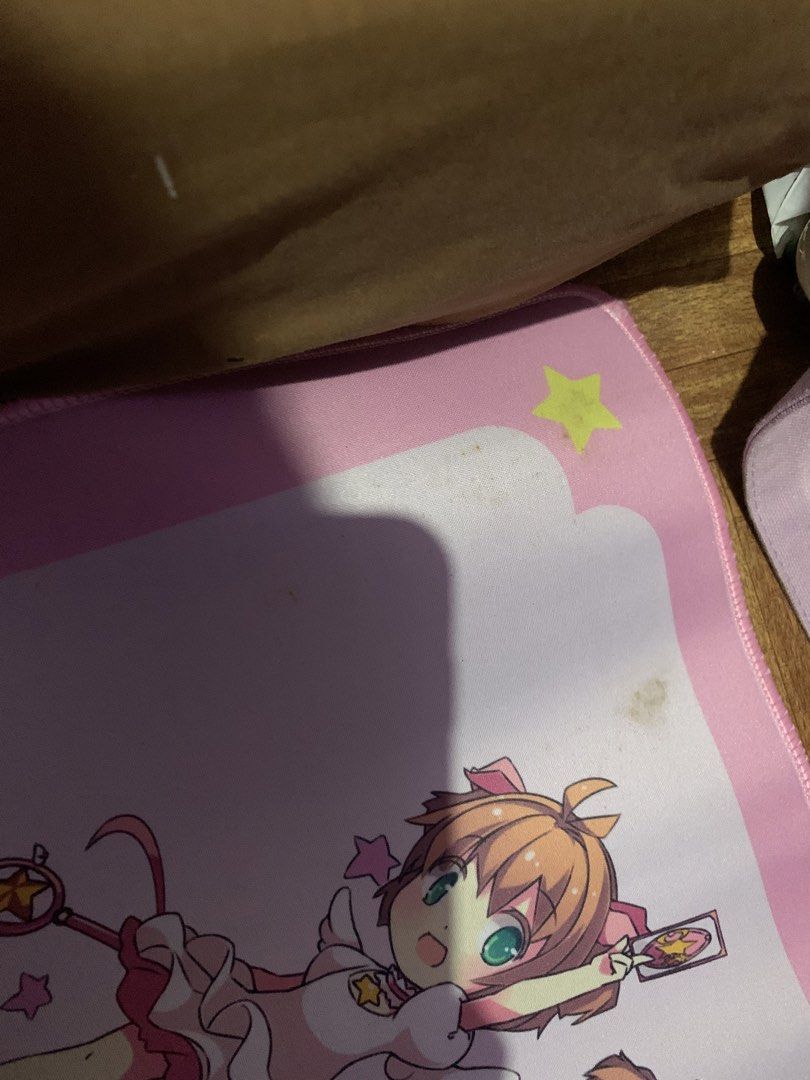 Cardcaptor Sakura Desk Mat - Pink Anime Mousepad (Category: Mouse & Mousepads) located in Manila. Submitted by usagichan_rabbit (Listing ID 1452590622, Image 2). Description: -Brandnew pero may dumi pwede pa malabhan - Cute pink desk mat featuring Cardcaptor Sakura design. - Includes 'Trick' text and a magic circle at the bottom. - Perfect for anime fans and collectors..