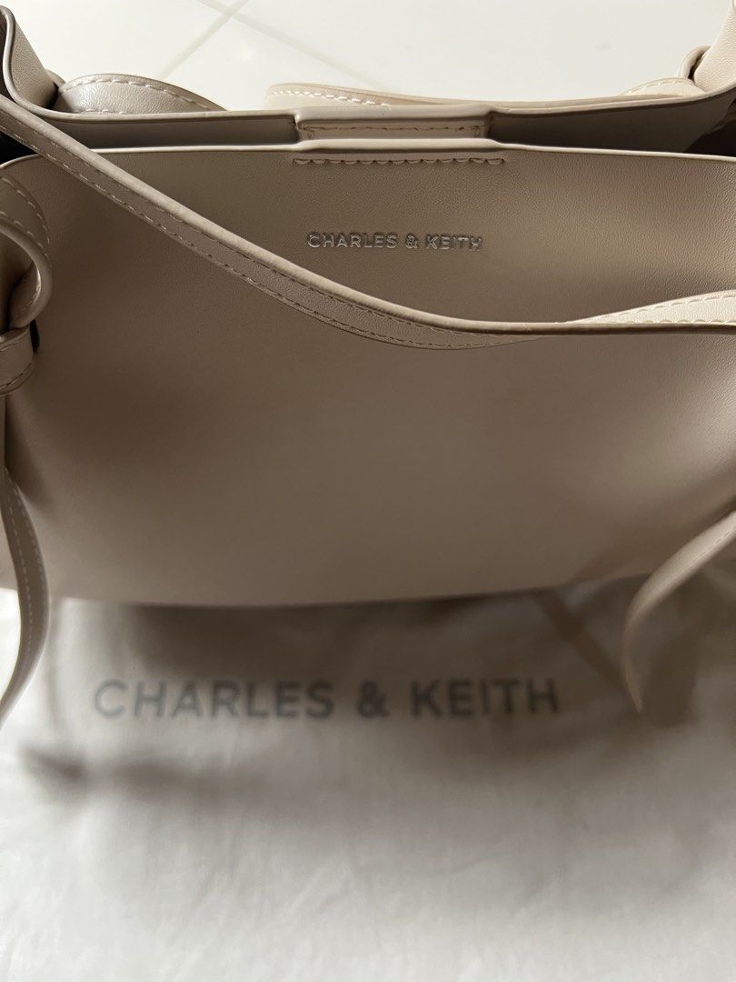 CHARLES & KEITH Calla Tote Bag - Oat (Category: Tote Bags) located in Batangas. Submitted by bebot943 (Listing ID 1452564564, Image 2). Description: RFS: not my style anymore haha - comes with dustbag & puch - pouch has makeup stains see photo - no refunds/ returns/ exhanges details: Material Calf PU Number of bag strap: 2 Inner compartment: 1 Pouch(es) Handle drop length: 31 cm Detachable strap: Non-Detachable Adjustable strap: Non-Adjustable Ty