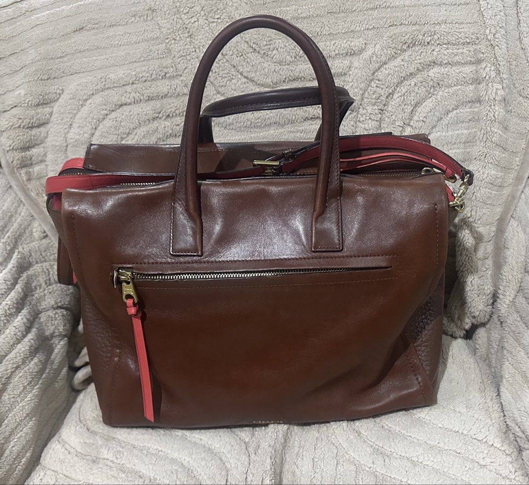 Coach 2-tone Brown Leather Tote Bag (Category: Luxury Bags & Wallets) located in Quezon City. Submitted by marengcondo (Listing ID 1452617305, Image 2). Description: MAJOR DECLUTTERING ONGOING - Genuine 2-tone brown leather Coach tote bag - Stylish pink accents on tag and strap - Versatile carrying options: top handles and detachable shoulder strap - Secure zipper closure for top access - spacious interior (please note ballpen mark shown in photo