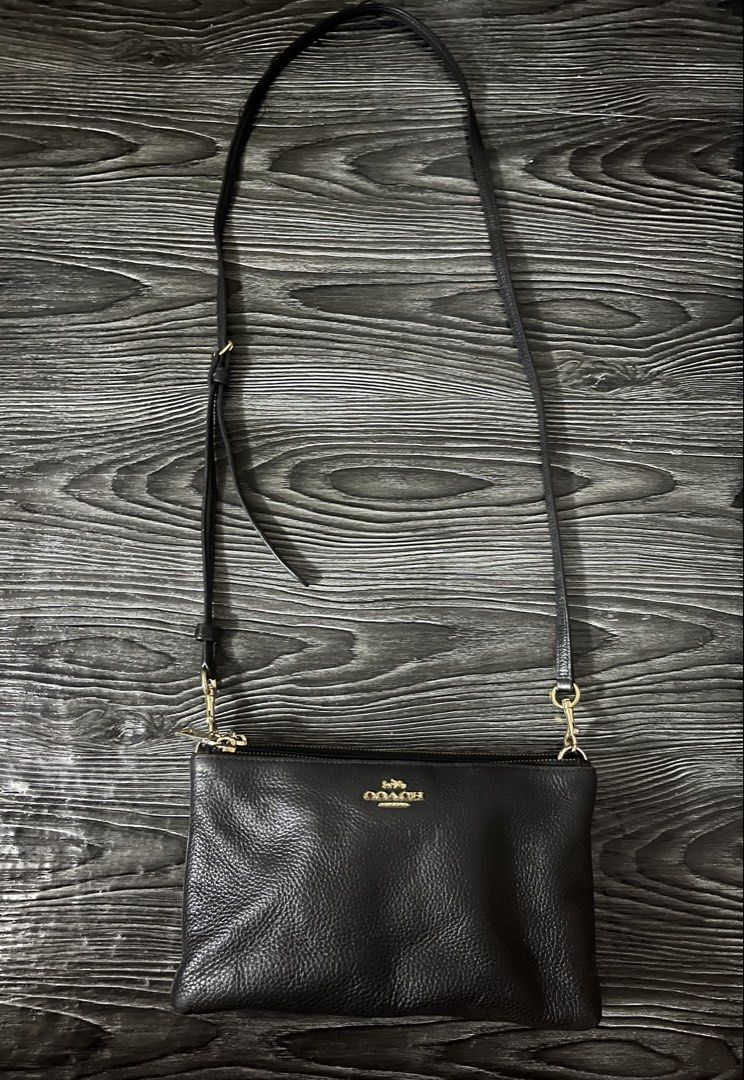 Coach Black Leather Double Zip Crossbody Bag (Category: Luxury Bags & Wallets) located in Manila. Submitted by merryjoyan39637 (Listing ID 1452615188, Image 1). Description: Designed to be durable, this crossbody bag from Coach is a prized buy. Comfortable and easy to carry, this leather creation comes in a black hue with the brand logo detail on the front. It has an adjustable shoulder strap and double zip closures that open to canvas insides fo