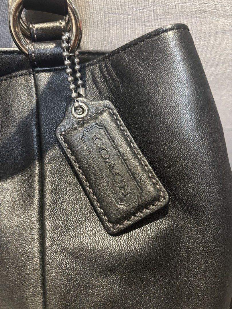 Coach Black Leather Soho Tote Bag (Category: Luxury Bags & Wallets) located in Quezon City. Submitted by castrob21 (Listing ID 1452624170, Image 2). Description: Classic black Coach leather shoulder bag with a silver buckle closure. Soft leather with a nice sheen. Minimal pressmarks on the leather.