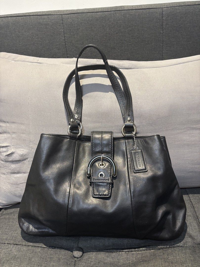 Coach Black Leather Soho Tote Bag (Category: Luxury Bags & Wallets) located in Quezon City. Submitted by castrob21 (Listing ID 1452624170, Image 1). Description: Classic black Coach leather shoulder bag with a silver buckle closure. Soft leather with a nice sheen. Minimal pressmarks on the leather.