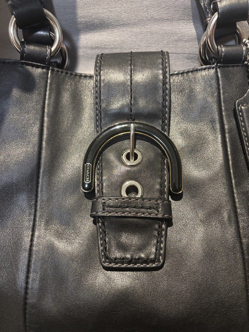 Coach Black Leather Soho Tote Bag (Category: Luxury Bags & Wallets) located in Quezon City. Submitted by castrob21 (Listing ID 1452624170, Image 3). Description: Classic black Coach leather shoulder bag with a silver buckle closure. Soft leather with a nice sheen. Minimal pressmarks on the leather.