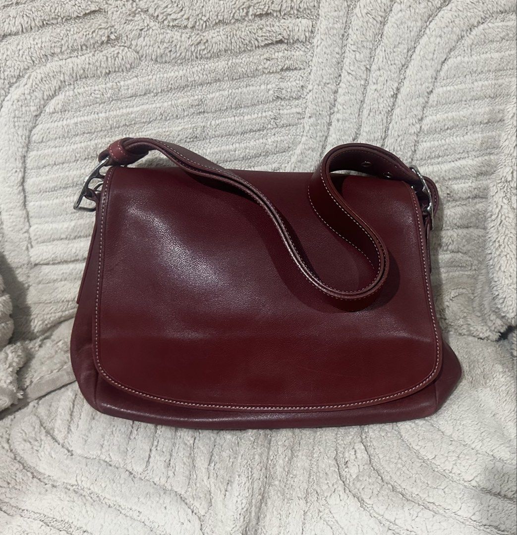 Coach Burgundy Leather Shoulder Bag (Category: Luxury Bags & Wallets) located in Quezon City. Submitted by marengcondo (Listing ID 1452616312, Image 1). Description: MAJOR DECLUTTERING ONGOING - Authentic classic burgundy leather shoulder bag by Coach. - Lined with signature Coach print. - Elegant silver hardware accents. - Adjustable strap with buckle for customized fit. - Ideal for everyday wear. - with original dustbag.